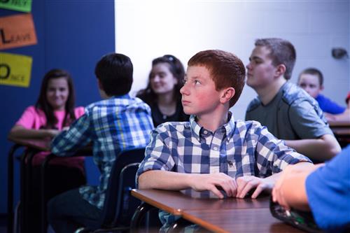 male student looking left 