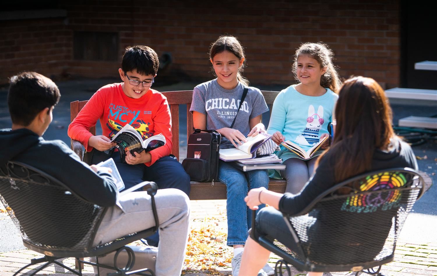 Students reading books outside Students reading books outside